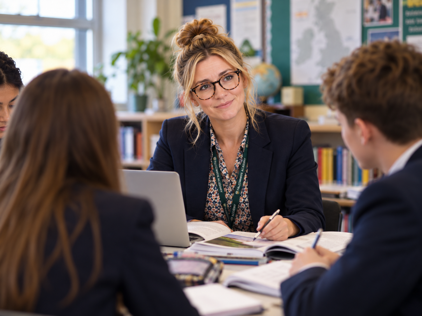 Fictional staff member Miss Direction working with students and a laptop.